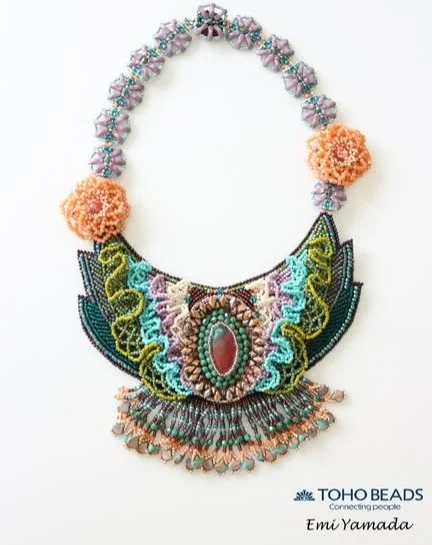 TOHO Challenge 2025 “Sonoran Sunset”
Featured Designer: Emi Yamada （山田　恵美）~TOHO BEADS Advanced Designer~
https://www.a-chocoo.com/
@chocoo2019 
Title: “Power of the Earth” ~大地の力~

「大地の石からあふれるパワーから草木が生まれ
花が咲き、生命があふれていくイメージを表現しました。
とても素敵な石をありがとうございました。」

“From the overflowing power of the earth's stones, plants and trees are born.
Flowers bloom and life becomes more abundant.
Thank you for the very beautiful stone.”

#tohobeads #tohochallenge2025 #teamtohobeads #starmanbeads #bobbybeadstore #twinklebeadsdortmund #ilovetohobeads #tohobeadsconnectingpeople #glassbeadart #tohochallenge