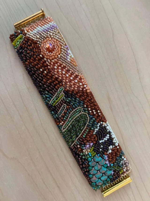 Take the TOHO Challenge 2025 - Sonoran Sunset 

This beautiful bracelet was created by mini-kit designer Shelley Bettencourt 

"My 2025 piece was designed based on my family vacation in the desert when I was 13. My mom took so many award-winning photos on our trip across the country and these colors and the Sonoran Sunset theme inspired my need to create a bead embroidery bracelet based on that experience."

See many more great pieces at https://www.facebook.com/TeamTOHO/

#tohobeads #tohochallenge2025 #teamtohobeads #starmanbeads #bobbybeadstore #twinklebeadsdortmund #ilovetohobeads #tohobeadsconnectingpeople #glassbeadart #tohochallenge
#トーホービーズ #トーホーチャレンジ